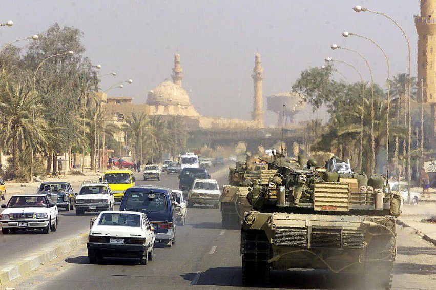 A Marine Corps M1 Abrams tank patrols Baghdad after its fall in 2003
