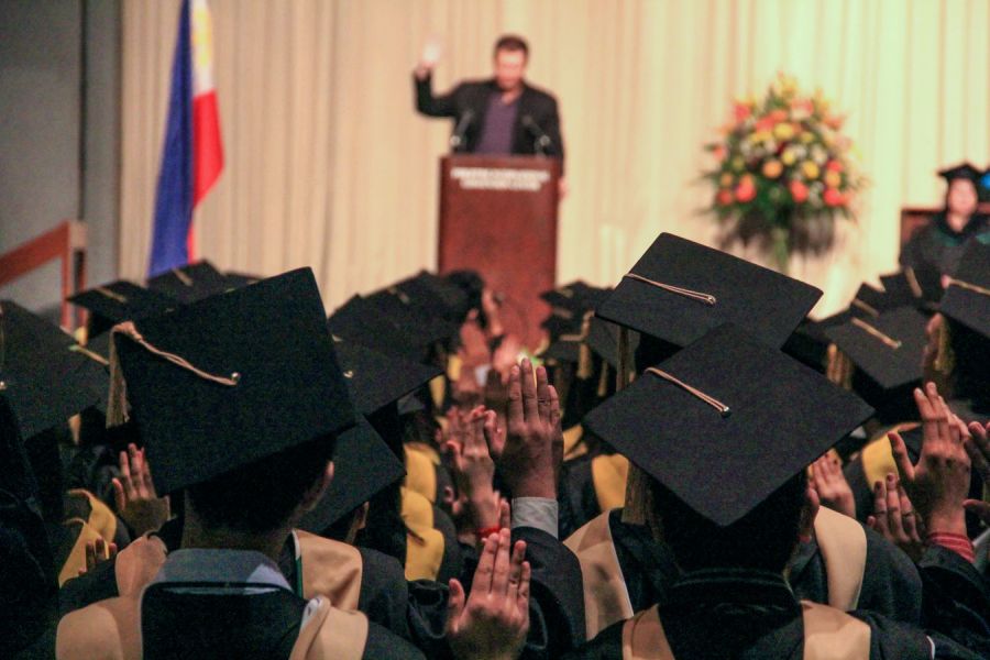 A person giving a speech on the commencement day