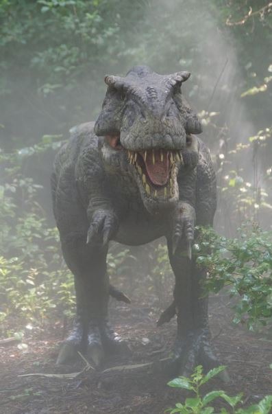 A CGI of a dinosaur walking in a foggy environment